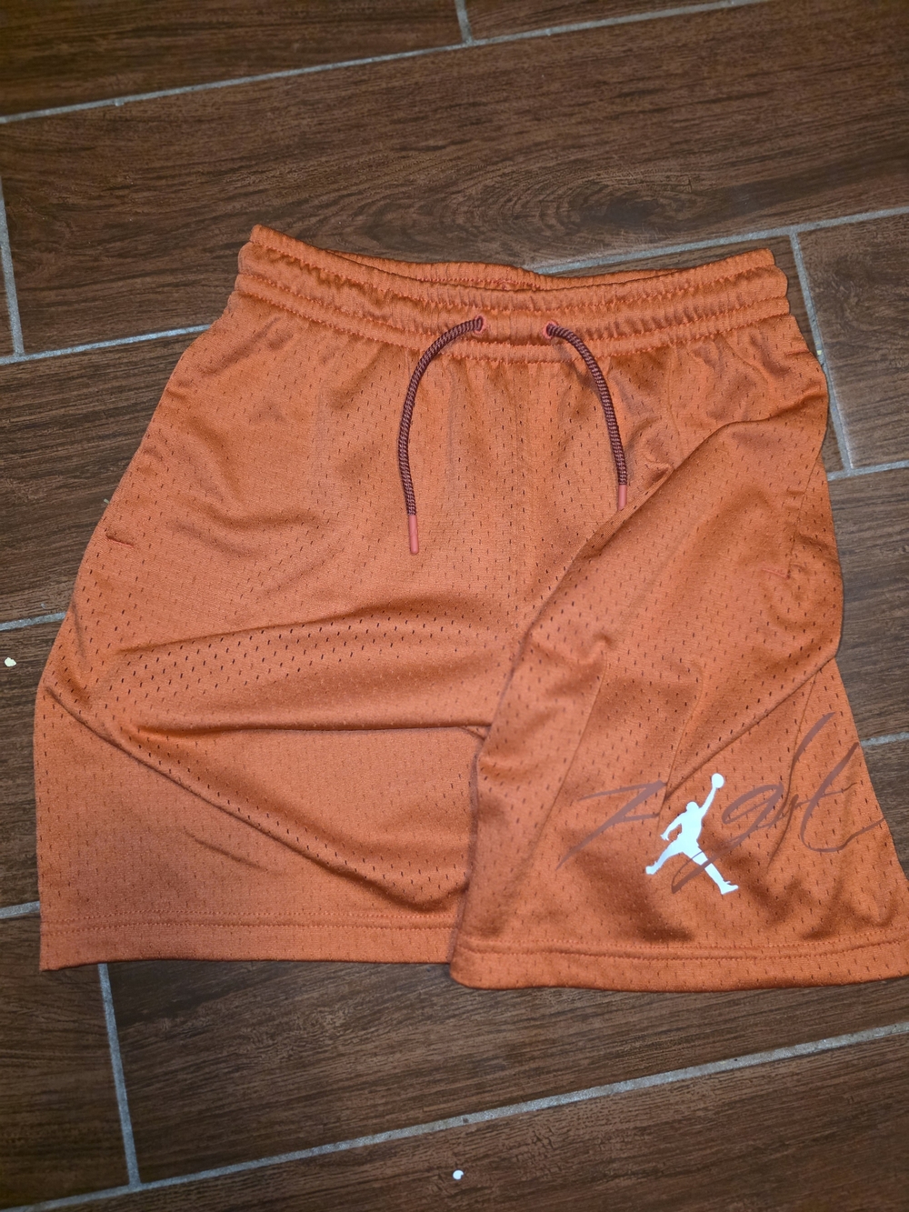 Jordan Orange Mesh Athletic Shorts with White Jumpman